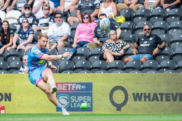 Picture by Allan McKenzie/SWpix.com - 20/07/2024 - Rugby League - Betfred Super League Round 18 - Hull FC v Wigan Warriors - MKM Stadium, Kingston upon Hull, England - Wigan's Adam Keighran kicks a conversion against Hull FC. : Adam