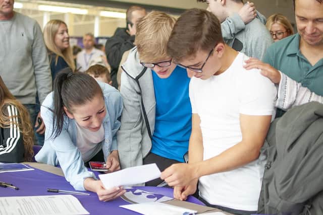 Excited Golborne High pupils study their GCSE results