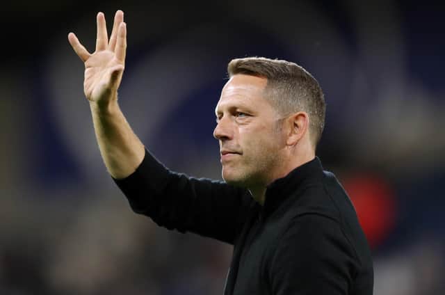 Leam Richardson waved goodbye to Wigan Athletic on Thursday morning