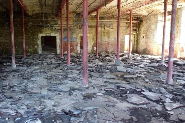 Debris covers the floors inside Pagefield Mill