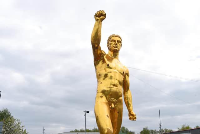 A 40ft gold statue of a naked Greek god has appeared on Manchester Road, Ince, near Darlington Street.