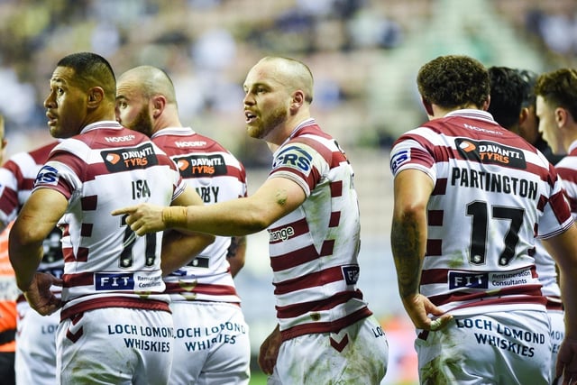 The Wigan players celebrate their win.