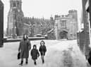 A winter scene on Cross Street, Standish, featuring  St. Wilfrid's Church, Standish, after a heavy snowfall in 1968.