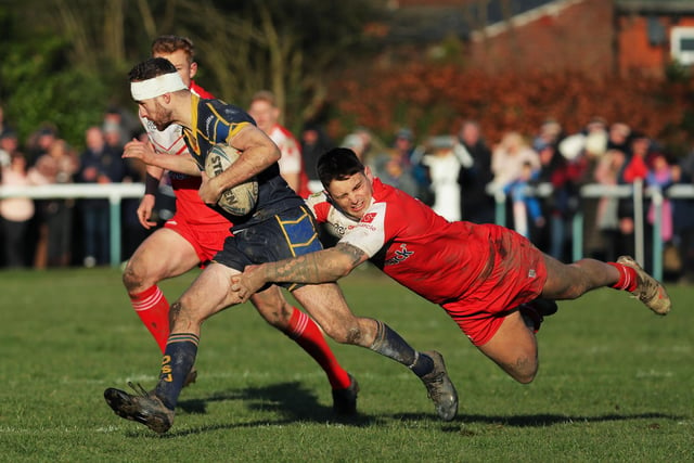 Orrell's Bradley Kelk is tackled by the British Army's Pete Holmes.
