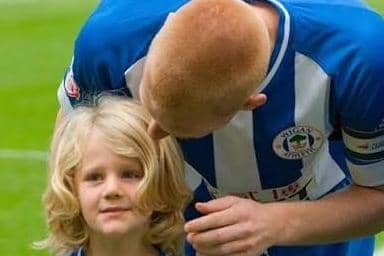 Reggie Watson makes an early appearance as a mascot at Wigan during the 2013/14 season