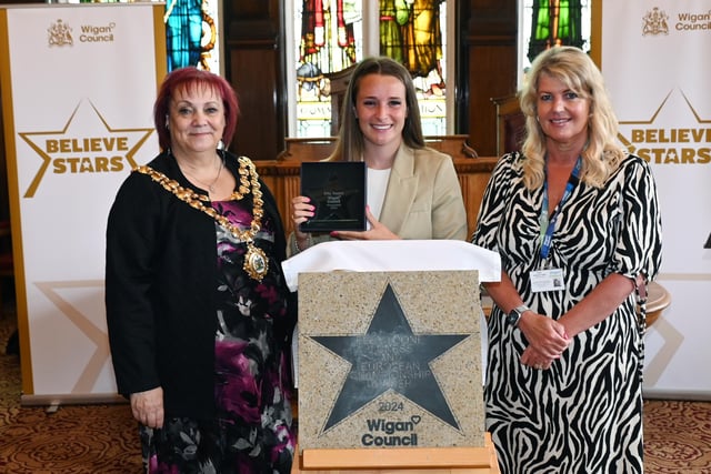 Football champion Ella Toone, Lioness and European Championship Winner, centre, pictured with the Mayor of Wigan Coun Debbie Parkinson, left, and Wigan Council Chief Executive Alison McKenzie-Folan, right, is presented with a Wigan Council Star at Leigh Town Hall.