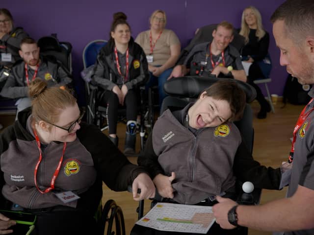 Amy and Anna delivering training with Happy Smiles team members watching on behind