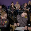 Amy and Anna delivering training with Happy Smiles team members watching on behind