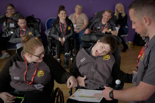 Amy and Anna delivering training with Happy Smiles team members watching on behind
