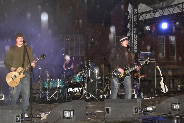 2004 - McFly perform on stage at the Christmas light switch on in Wigan town centre.