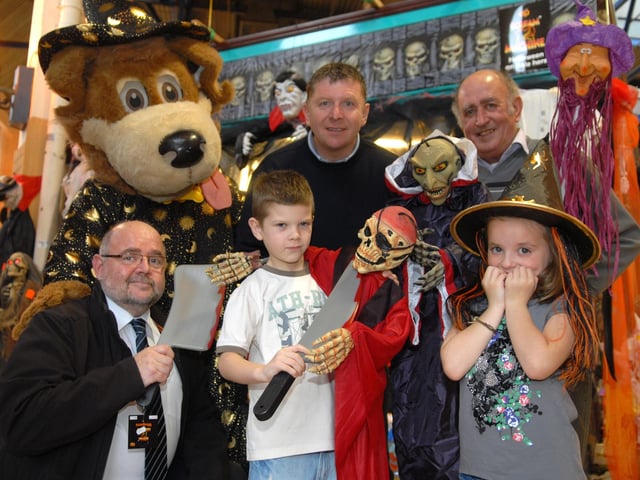 Halloween stall at Wigan Indoor Market with Wiggy the town centre mascot, Tony Fletcher, deputy markets manager, Michael Connor, traders' committee member, Adam Cottle, Casey McAvoy and stallholder Dave Clitherow