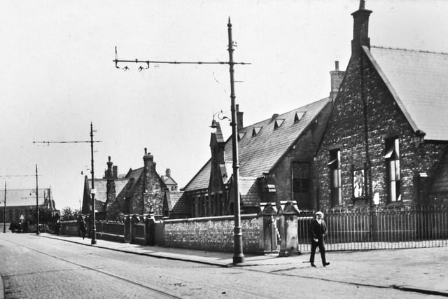 St. Mary's School, Warrington Road, Lower Ince, on the right and St. Mary's Church on the left around the 1920s.
The original church was demolished in 1978 due to mining subsidence and the school converted into the church.