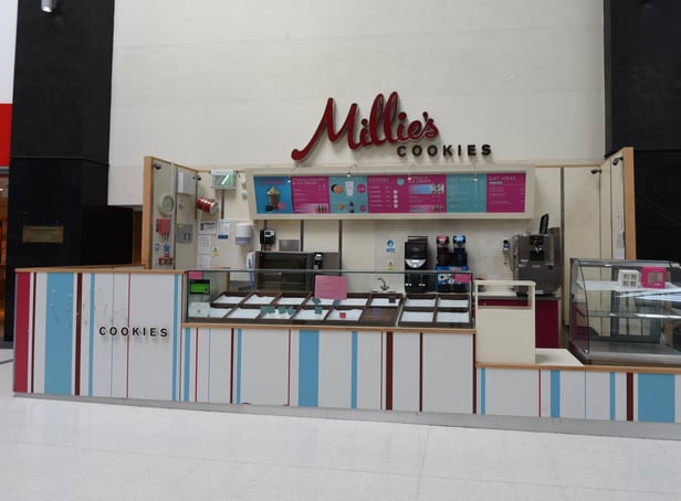The empty Millie's Cookies kiosk