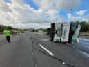 The overturned lorry that has caused the closure of the M6 near Preston on Sunday
