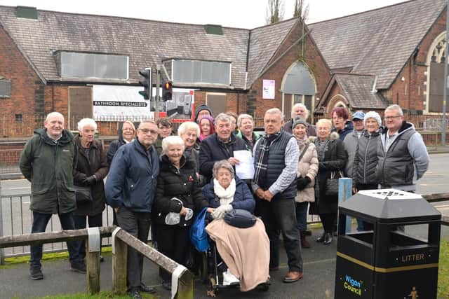 Members of the community and local councillors pictured outside the former St John The Baptist School, New Springs