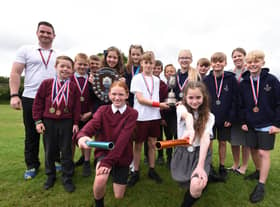 Sports co-ordinator Mr Carr and headteacher Mrs Gough with pupils from Year four, five and six, at Wood Fold Primary School.