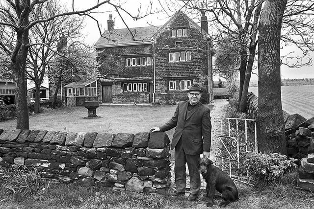 Owner, Geoffrey Gill, at the gate of Giant's Hall Farm in Standish Lower Ground  with a date of 1675 on the wall and threated by NCB opencast plans in May 1977.