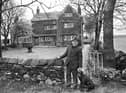 Owner, Geoffrey Gill, at the gate of Giant's Hall Farm in Standish Lower Ground  with a date of 1675 on the wall and threated by NCB opencast plans in May 1977.