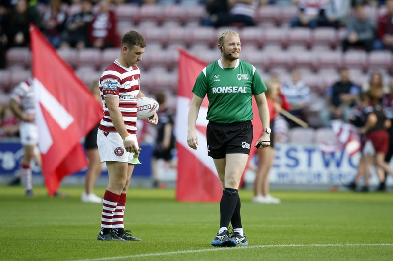 Harry Smith prepares to get the match underway, with Roberts Hicks delivering the ball ahead of his 300th Super League game.