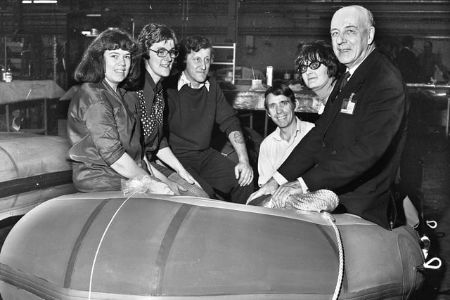 Round the World yachtsman Sir Alec Rose with workers during a visit to the Dunlop factory in Hindley on Friday 22nd of April 1977.
They are sat in one of the types of dinghies made at the factory and taken along by Sir Alec on his epic voyages.