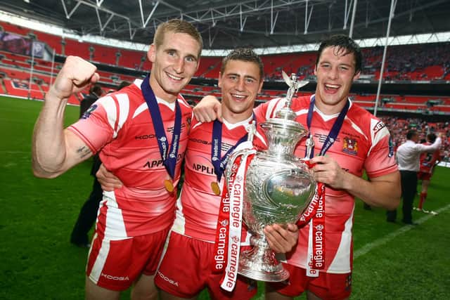 Sam Tomkins, Michael McIlorum and Joel Tomkins with the Challenge Cup in 2011