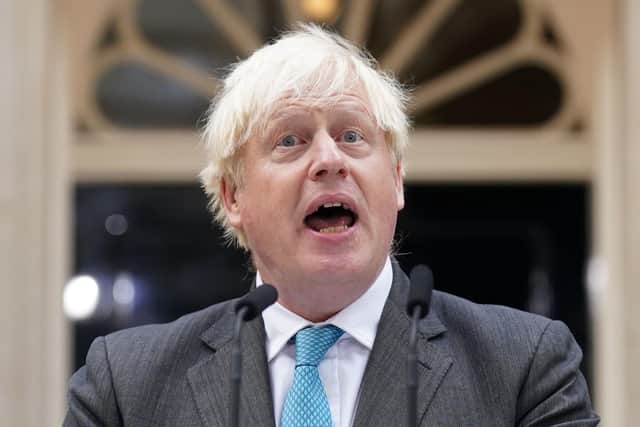 Boris Johnson resigning as Prime Minister last September