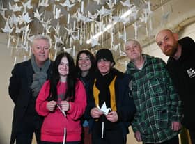 from left, Brian Whitmore, Tonie Edwards, Louise Fazackerley, Joanne Edwards, David Jones and Aaron Pearce installing the artwork.