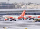 Snowploughs clearing snow at Manchester Airport. Picture by Martin Rickett. Credit: PA Wire/PA Images