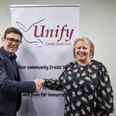 Greater Manchester Mayor Andy Burnham with Angela Fishwick, chief executive of Unify Credit Union in Wigan