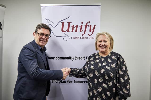 Greater Manchester Mayor Andy Burnham with Angela Fishwick, chief executive of Unify Credit Union in Wigan