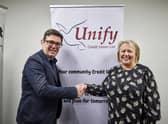 Greater Manchester Mayor Andy Burnham with Angela Fishwick, chief executive of Unify Credit Union in Wigan