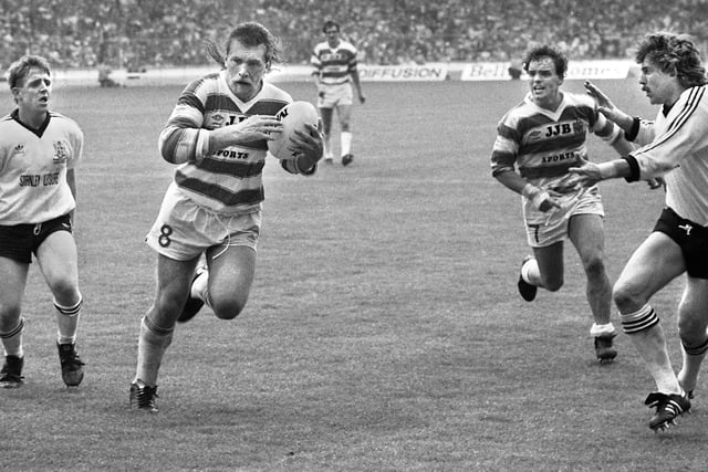 Wigan's Australian forward Kerry Hemsley with Gary Stephens in support finds the gap between Mick Burke, Andy Gregory and Stuart Wright to score a consolation try against Widnes in the Challenge Cup Final at Wembley on Saturday 5th of May 1984.
Wigan lost the match 6-19.