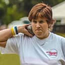 Claire Buckle participating in the shot put