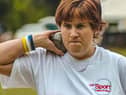 Claire Buckle participating in the shot put