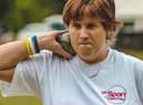 Claire Buckle participating in the shot put