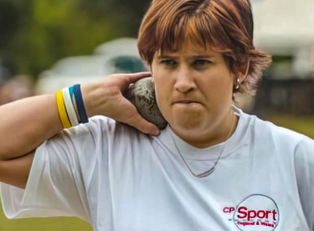 Claire Buckle participating in the shot put