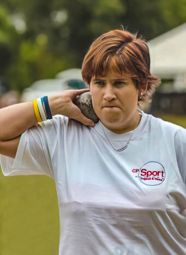Claire Buckle participating in the shot put