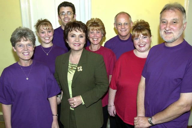 Former TV and recording superstar, Dana, with local gospel singers, Kindred Spirit, before going on stage at Standish Methodist Church, High Street, on Thursday 19th of September 2002. Dana had become a Euro MP for the Connacht-Ulster constituency in Ireland and was giving up singing to concentrate on politics and humanitarian campaigning. She agreed to perform as part of a fund raising effort concert at the church after being invited by fellow MEP, Terry Wynn and wife, Doris, who were both regular church-goers at the chapel. Dana would probably be best remembered for her Eurovision Song Contest winning entry "All Kinds of Everything" in 1970.