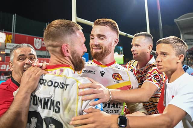 Catalans' Adam Keighran and Sam Tomkins celebrate their victory over St Helens progressing them through to the Grand Final