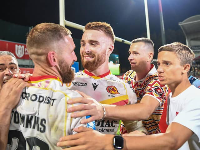 Catalans' Adam Keighran and Sam Tomkins celebrate their victory over St Helens progressing them through to the Grand Final