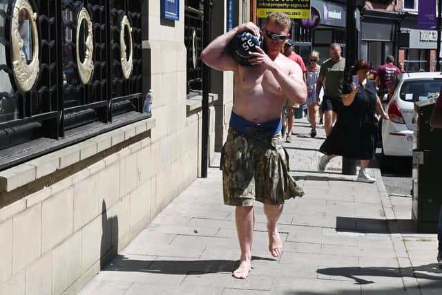 Nigel Brookwell walked barefoot, wearing just a kilt, from Wigan to Standish and back the next day