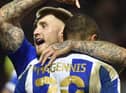 Stephen Humphrys congratulates Josh Magennis after his goal