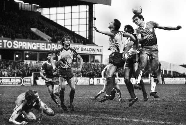 Wigan Athletic centre-forward Les Bradd in a mid air battle against Telford United in the FA Cup 1st round match at Springfield Park on Sunday 21st of November 1982 which ended in a 0-0 draw.