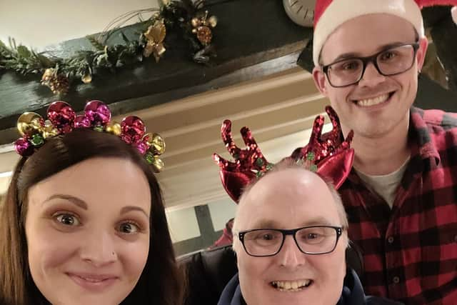 Derrick Cunliffe (centre) pictured with daughter Terri Morris and her husband Ben at a family Christmas