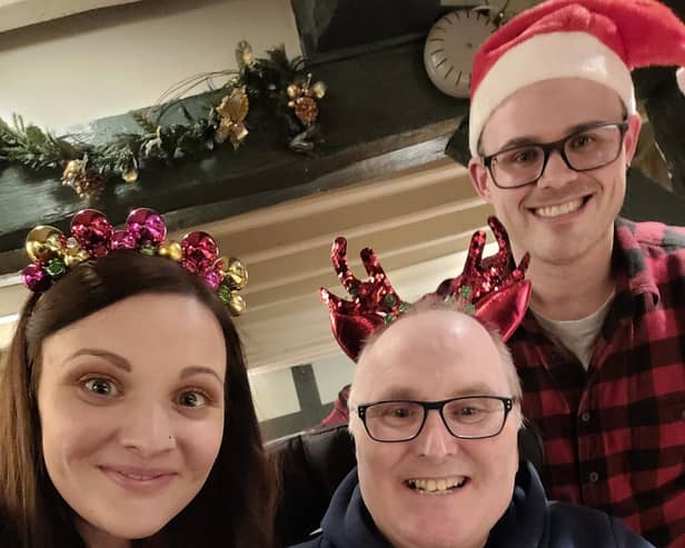 Derrick Cunliffe (centre) pictured with daughter Terri Morris and her husband Ben at a family Christmas