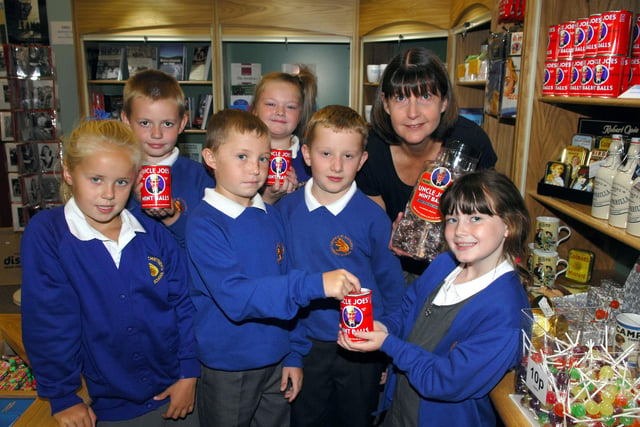 Highfield St Matthew's CP School year four visit to the Wigan Life Museum.
Sue Maiden, learing officer, is pictured with some of the pupils as they look at  Uncle Joes sweets which are made in Wigan.