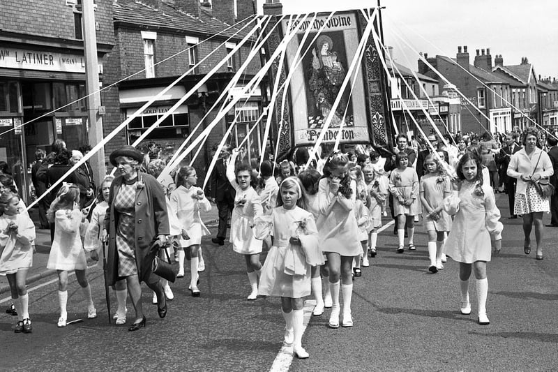 The banner girls lead the way up Ormskirk Road on walking day for St. John's, Pemberton, on Sunday 9th of June 1974.
