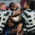 Wakefield’s Sam Eseh is tackled by Josh Griffin, Chris Satae and Jack Brown
