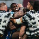 Wakefield’s Sam Eseh is tackled by Josh Griffin, Chris Satae and Jack Brown