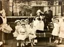 A young Elaine is crowned queen for the day during the 1953 coronation celebrations in Beech Hill. Doing the crowning is rugby legend Joe Egan